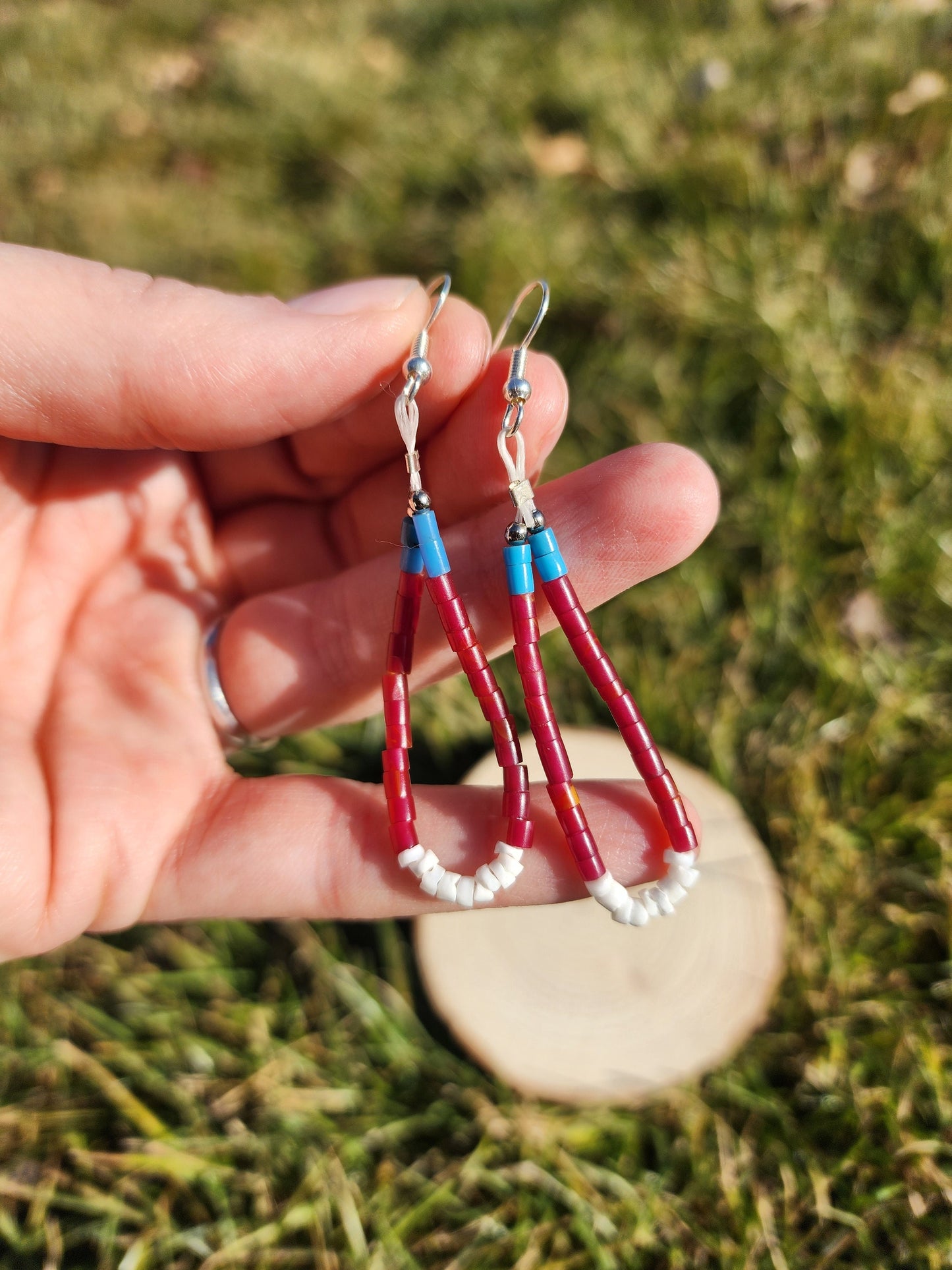 Traditonal Navajo red white blue synthetic heishi and white shell dangly earrings