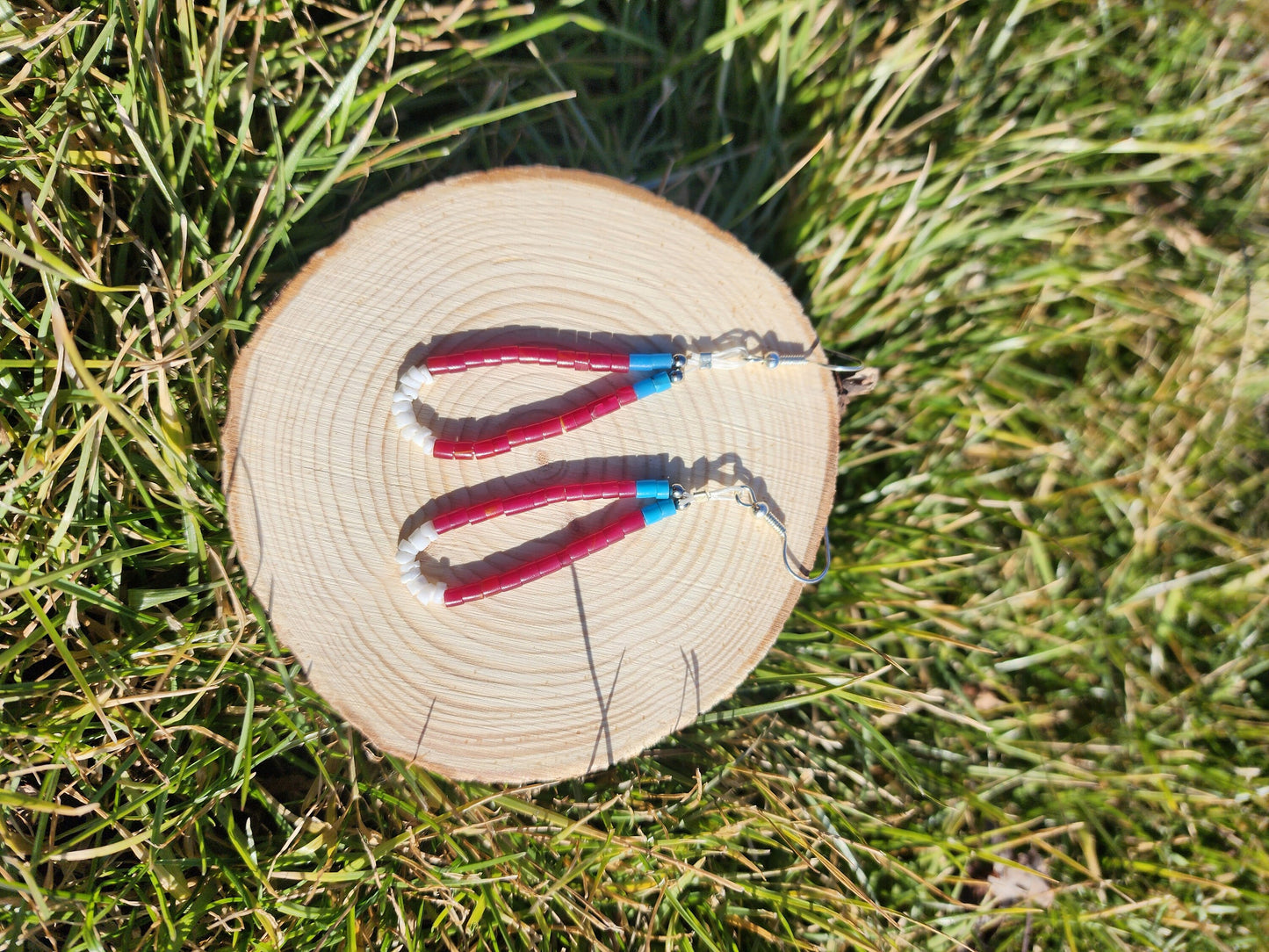 Traditonal Navajo red white blue synthetic heishi and white shell dangly earrings